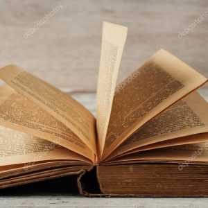 depositphotos_104704592-stock-photo-open-old-book-wood-background